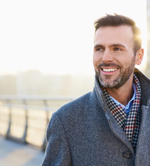 Man smiling outdoors