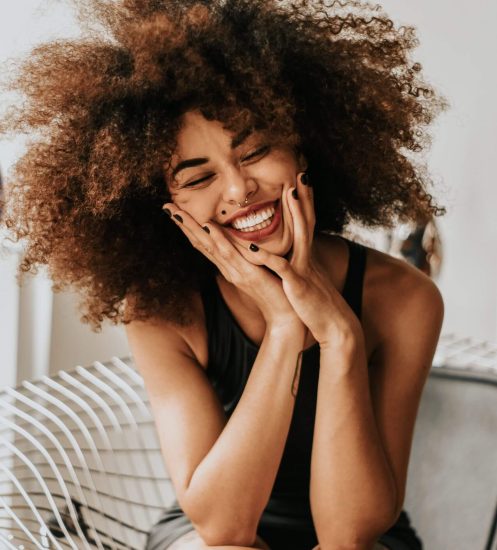 Patient smiling confidently after a dental visit